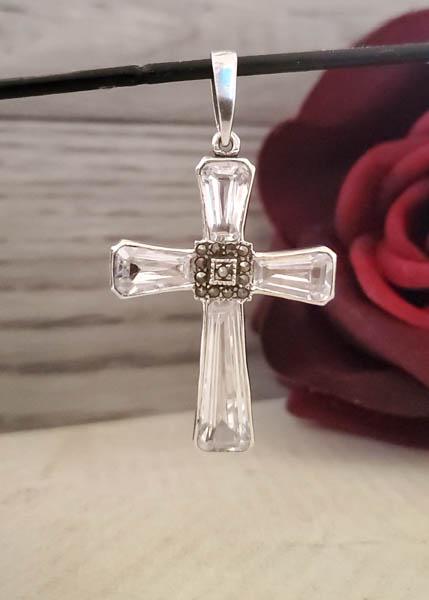 Sterling Silver Stone Cross Pendant: Item Details:Sterling Silver Cross Pendant Type: Pendant Length: 52.31mm Drop Width: 29.36 mm Other: N/A Stone Type: Zirconia Marcasite Stone Cut: Round Custom Stone Color: Clear Shape/Style: Religiou