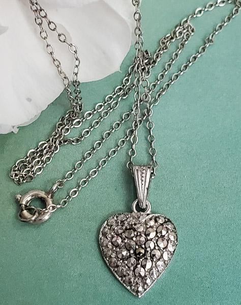 Sterling Silver Necklace: Item Details: Sterling Silver Marcasite Heart Necklace Chain Length: 16 Inches Pendant Drop: 21 mm Pendant Width: 12 mm Clasp: Springring Weight in Grams: 2.1 Hallmarks and Stamps: Sterling, Geman Ste