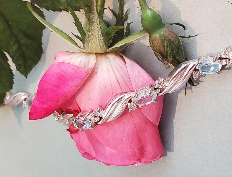 Sterling Silver Topaz Bracelet: Item Details: Light Blue Topaz Tennis Bracelet Length: 7.5 Inches Width: 6 mm Shape/Style: Tennis Stone Type: Topaz and CZ Stone Cut: Oval and Round Stone Color: Light Blue, Clear Carats: Not Reviewed