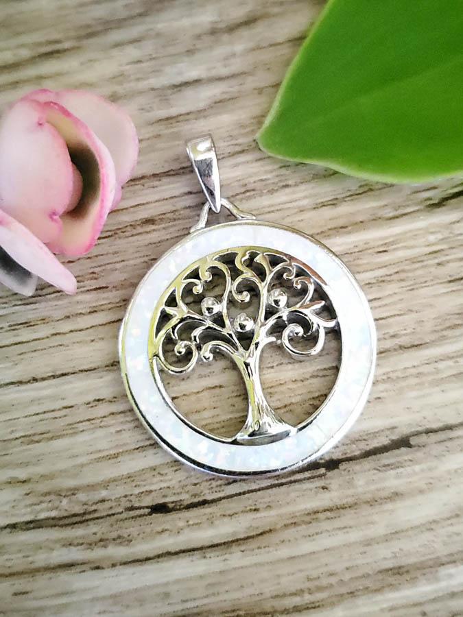 Sterling Silver Opal Pendant: Item Details: Sterling Silver Opal Family Tree Pendant Type: Pendant Length: 35 mm Width: 25 mm Stone Type: Opal Stone Cut: Inlaid Stone Color: Multi Shape/Style: Circle/Tree Carats: Not Reviewed Weig