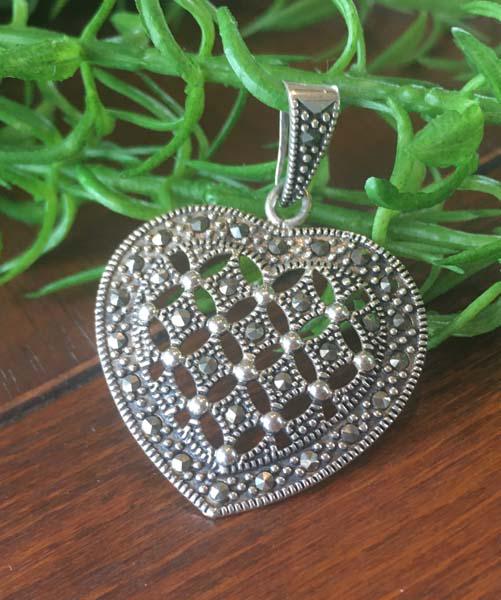 Sterling Silver Heart Pendant: Item Details: sterling silver marcasite heart pendant Measurement: 42.5mm drop, 30.8mm width Hallmarks & Stamps: 925 Weight in grams: 4.5 grams Shipping Time: Usually 2-5 Business Days Shipping Rates: