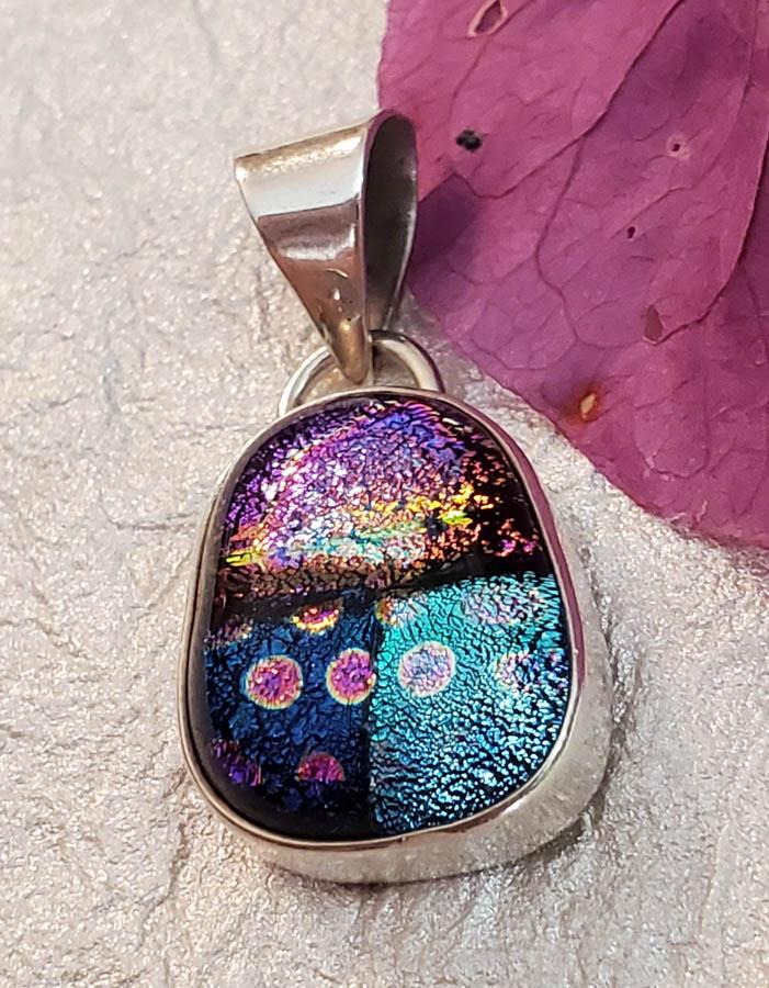 Art Glass Sterling Silver Pendant: Item Details: Foiled Art Glass Sterling Silver Pendant Length or Drop: 30 mm Width: 14.5 mm Weight in Grams: 4.41 Hallmarks and Stamps: 925 Other: