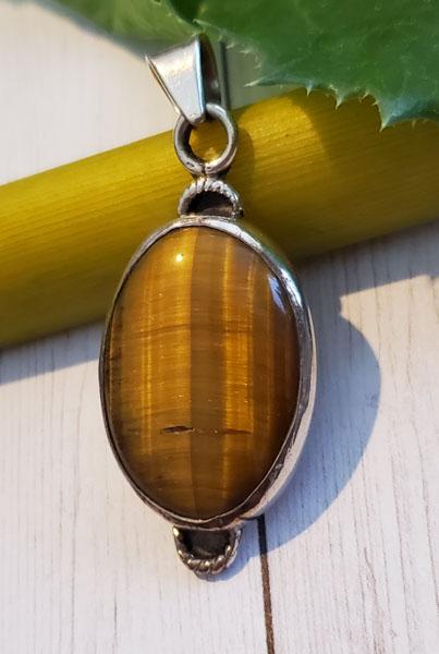 Sterling Silver Pendant: Item Details: Sterling Silver Pendant Type: Pendant Length: 46.3 mm Width: 19.2 mm Other: Stone Type: Natural Tiger Eye Stone Cut: Oval Stone Color: See Pics Shape/Style: Oval Carats: 15-20 Weight in 
