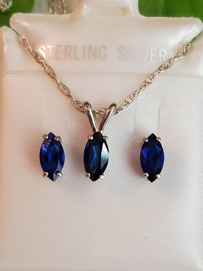 New on Card Sterling Spinel Set: Item Details: New on Card Sterling Spinel Set Measurements: Chain 18 inches, Pendant 13x4mm, Earrings 8x4mm Weight in Grams: 3.21 Hallmarks and Stamps: 925 Other: