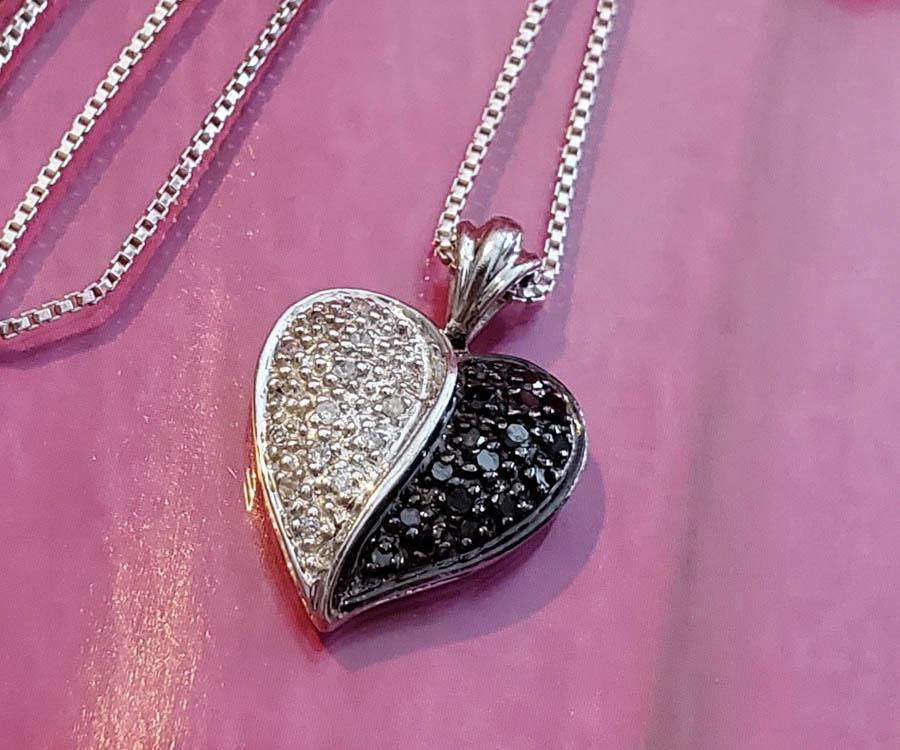 Sterling Silver Diamond Necklace: Item Details: Black and White Diamond Heart Chain Length: 18.25 Inches Pendant Removable: Yes Pendant Drop: 20.5 mm Pendant Width: 15 mm Clasp: Springring Stone Type: Diamond Stone Cut: Round Stone Co