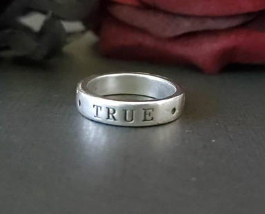 Sterling Silver True Love Waits Band: Item Details: Sterling Silver True Love Waits Band Ring Size: 6 Width if Band Ring: 4.5mm Ring Style: Quote: True love waits Weight in Grams: 4.87 Hallmarks & Stamps Include: Ster., Unknown, 86