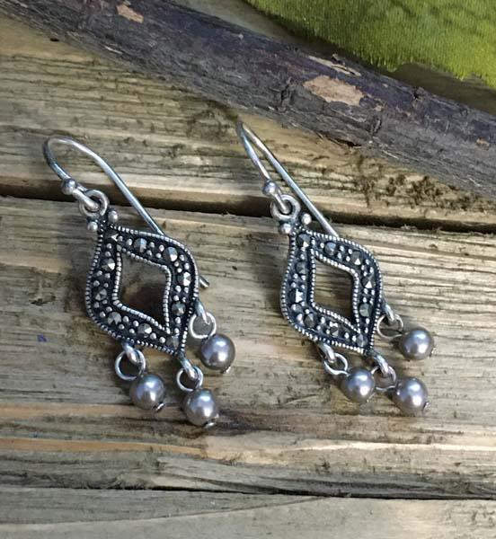 Sterling Silver Marcasite Earrings: Item Details: sterling silver marcasite earrings Measurement: 38mm drop, 12.6mm width Hallmarks & Stamps: 925 A China Weight in grams: 3.6 grams Shipping Time: Usually 2-5 Business Days Shipping Rates