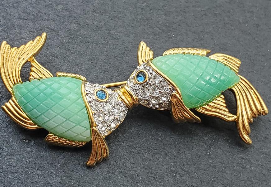 Kenneth J Lane Faux Jade Koi Brooch: The brooch is approximately 2.25 inches wide and 1 inch tall. The brooch has little to no wear on it. Shipping Time: Usually 2-5 Business Days Shipping Rates: Shipping rates start at $15 (US Only) for