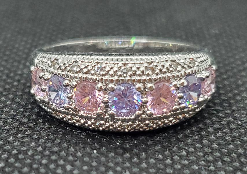 Sterling Silver Ring sz 11.5: Pink and Purple Cz Ring sz 11.5. Band is 10mm wide. Shipping Time: Usually 2-5 Business Days Shipping Rates: Shipping rates start at $15 (US Only) for 2-3 Day Priority Mail, contact us for our first-c