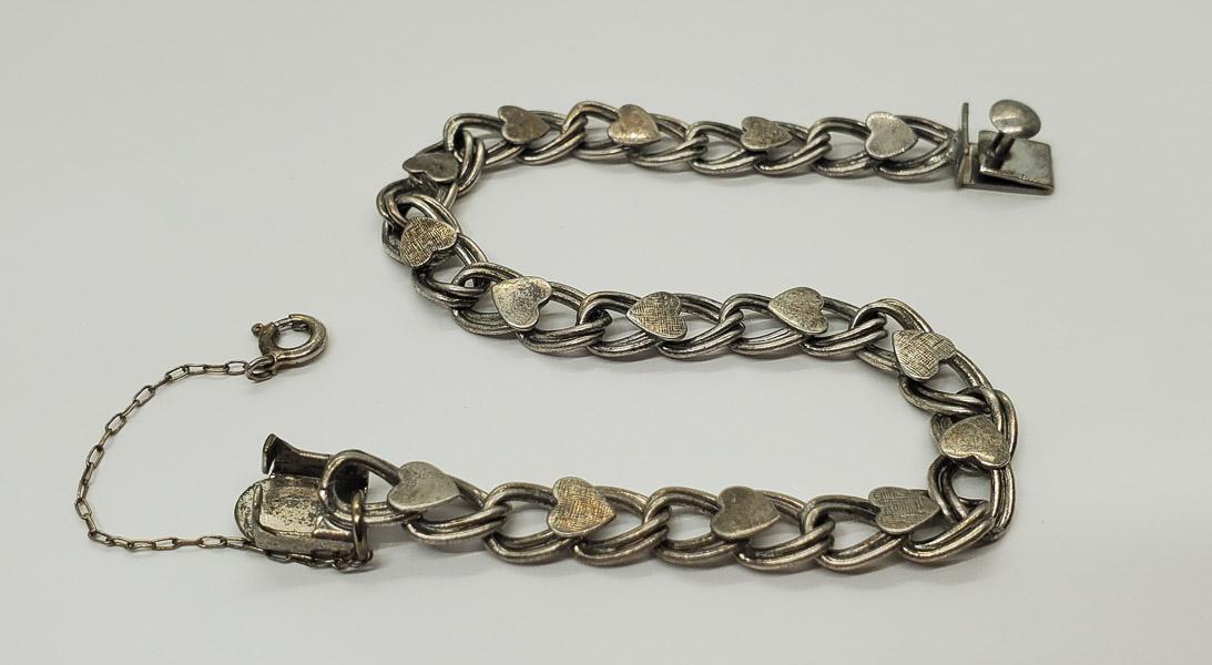 Vintage Lang Sterling Heart Link Charm Bracelet: Bracelet is 7 inches long. Shipping Time: Usually 2-5 Business Days Shipping Rates: Shipping rates start at $15 (US Only) for 2-3 Day Priority Mail, contact us for our first-class rates. Combined Ship