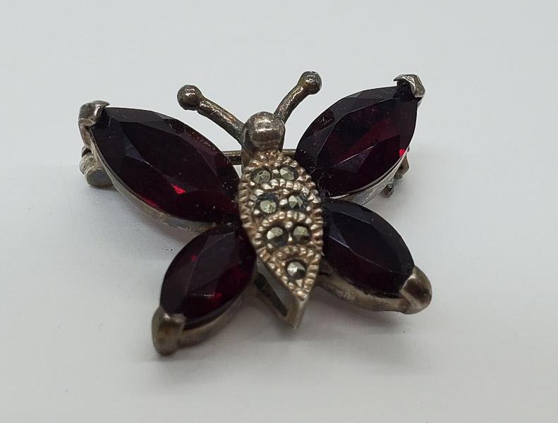 Sterling Silver Garnet and Marcasite Butterfly Brooch: Sterling Silver Garnet and Marcasite Butterfly Brooch Measures 17 x 23 mm Shipping Time: Usually 2-5 Business Days Shipping Rates: Shipping rates start at $15 (US Only) for 2-3 Day Priority Mail, cont