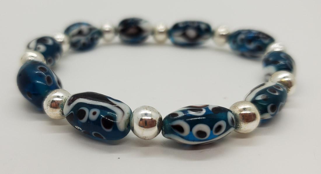 Silver Tone Art Glass Beaded Bracelet: Bracelet is a stretch bracelet. Shipping Time: Usually 2-5 Business Days Shipping Rates: Shipping rates start at $15 (US Only) for 2-3 Day Priority Mail, contact us for our first-class rates. Combined
