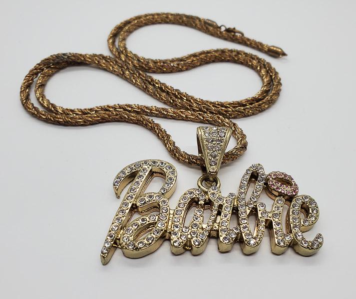 Large Rhinestone Barbie Necklace: Comes on a 36 inch chain that can be removed. Pendant has a 45.5mm drop and is 70mm wide. Shipping Time: Usually 2-5 Business Days Shipping Rates: Shipping rates start at $15 (US Only) for 2-3 Day Pri
