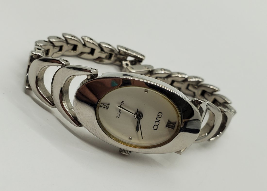 Gucci 1500 Watch: Watch is working. Band is 6.75 inches and face is 18mm wide. Shipping Time: Usually 2-5 Business Days Shipping Rates: Shipping rates start at $15 (US Only) for 2-3 Day Priority Mail, contact us for ou