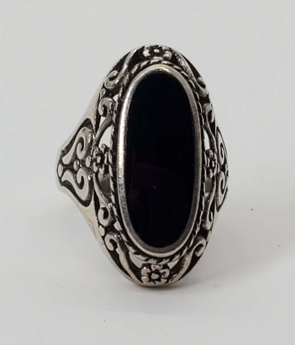 Scroll Designed Sterling and Onyx Ring Sz 8: Ring is size 8. Front is 26mm at widest pint and signed FAS, 925. Shipping Time: Usually 2-5 Business Days Shipping Rates: Shipping rates start at $15 (US Only) for 2-3 Day Priority Mail, contact us f
