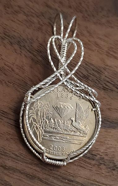 Tested Wire Wrapped Arkansas Coin Pendant: Please see the pictures for full details as this is the exact item you will receive. Weight in Grams: 9Hallmarks and Stamps: The wire t