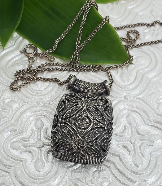 Sterling Silver Marcasite Necklace: Length: 18 InchesWidth: Pendant is 22mm wide with a 35mm dropClasp: Spring