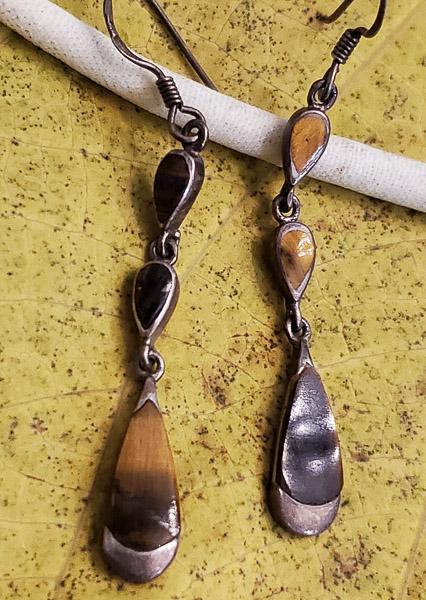 Vintage Tigers Eye Sterling Silver Earrings: Please see pics for details as this is the exact item you will receive. Measures: 54mm drop Weight in Grams: 3.5 Hallmarks & Stamps Include: 925 Please note: All items are taken at stamped value a