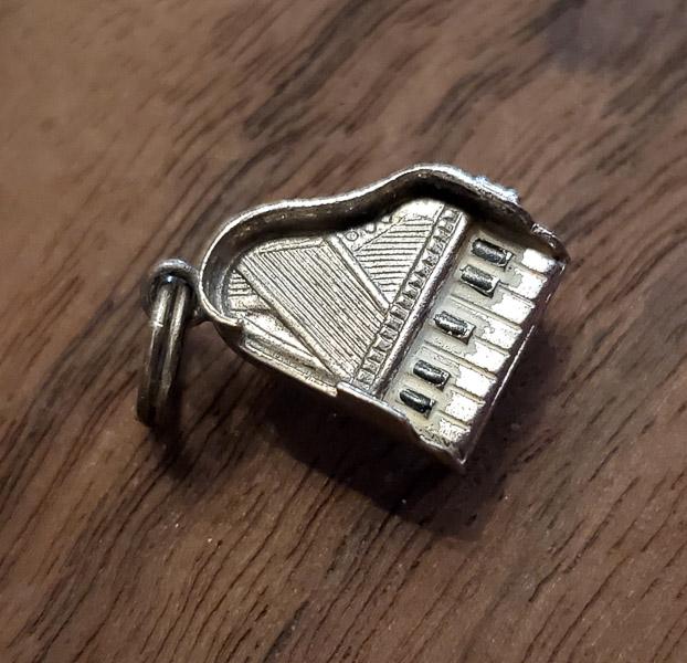 Piano Sterling Silver Vintage Charm: Please see pics for details as this is the exact item you will receive. Measures: 14mm x 10mm Weight in Grams: 1.4 Hallmarks & Stamps Include: Ster. Please note: All items are taken at stamped val