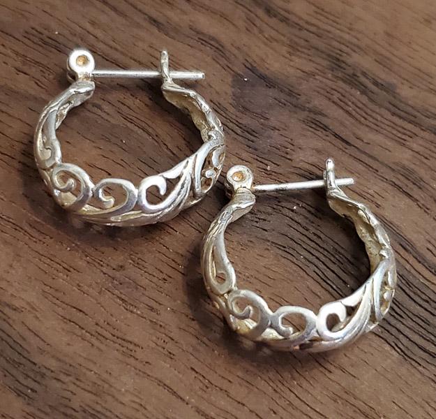 Scroll Design Sterling Silver Hoop Earrings: Please see pics for details as this is the exact item you will receive. Measures: Earrings have a 15mm drop and are 6mm wide Weight in Grams: 2 Hallmarks & Stamps Include: 925 Please note: All ite