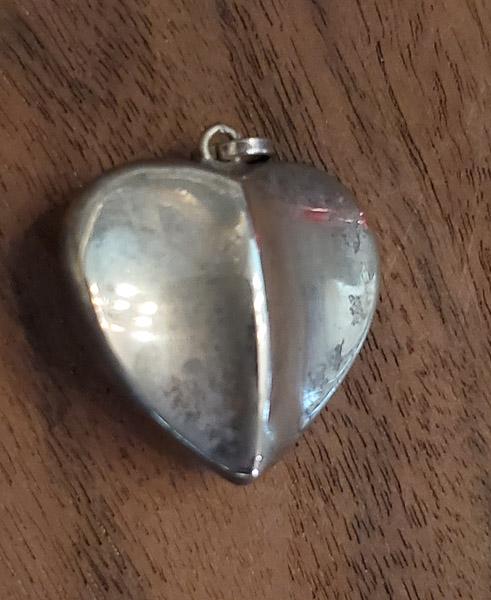 Sterling Silver Puffy Heart Pendant: Please see pics for details as this is the exact item you will receive. Measures: 26mm drop and 25mm wide Weight in Grams: 4.14 Hallmarks & Stamps Include: 925 Please note: All items are taken at 