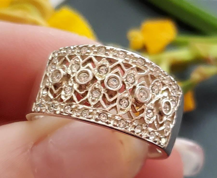 Sterling Silver Ring: Item Details: Sterling Silver Cz Ring Ring Size: 8 Ring Face: mm Width if Band Ring: at widest 10.7mm Weight in Grams: 4.8 Hallmarks & Stamps Include: 925, AN Other: Please note: All items are tak