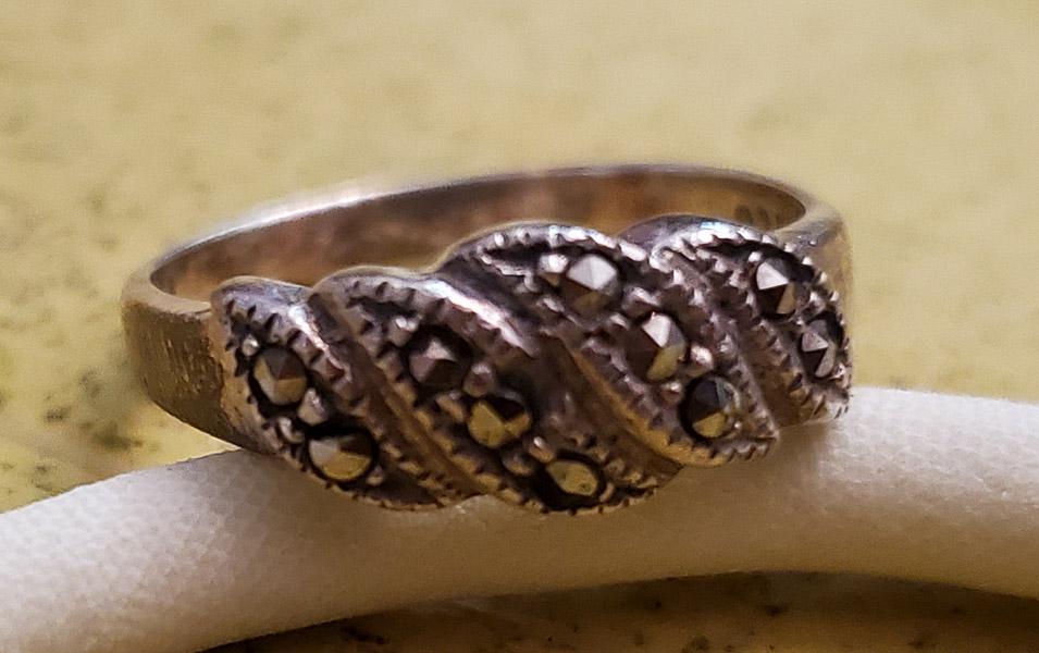 Sterling Silver Marcasite Ring: Item Details: Sterling Silver Marcasite Ring Ring Size: 7 Width if Band Ring: at widest 7.5mm Weight in Grams: 2.61 Hallmarks & Stamps Include: 925, SU Other: Please note: All items are taken at s