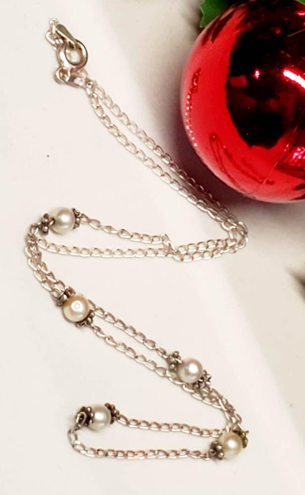 Italy Sterling Silver Pearl Necklace: Item Details: Sterling Silver Pearl Necklace Chain Length: 16 Inches Pendant Drop: 4.2 mm Pendant Width: 6.2 mm Clasp: SpringringÃ‚ Weight in Grams: 2.17 Hallmarks and Stamps: 925, Italy, P Other:�