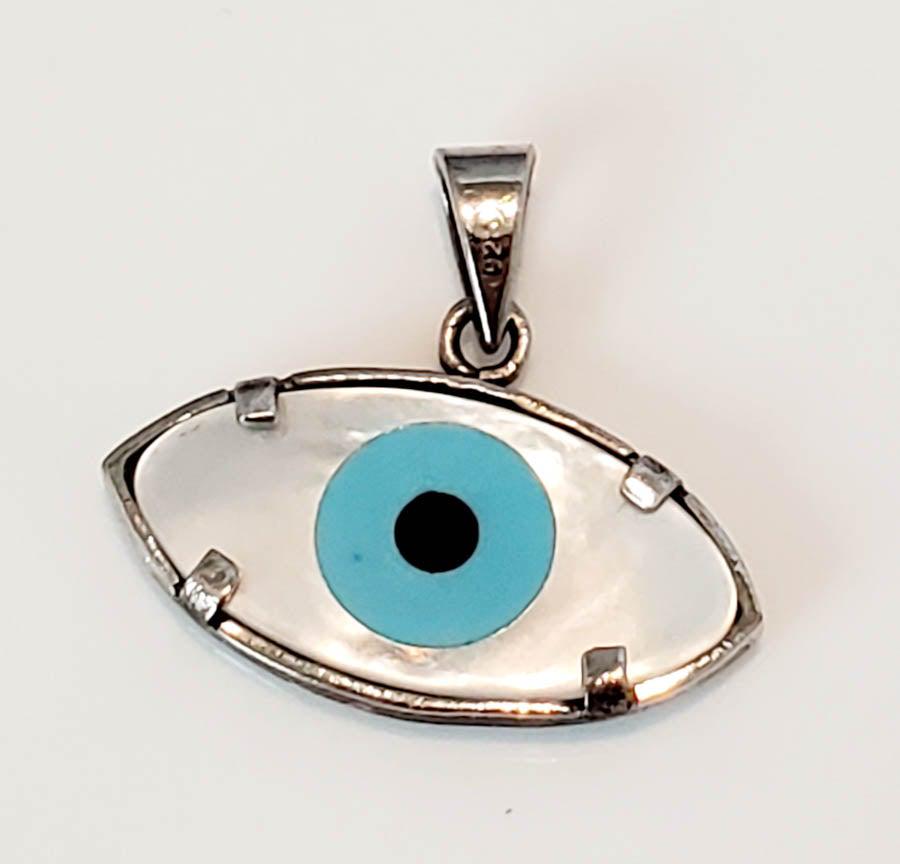 Sterling Silver Mother of Pearl Evil Eye Pendant: Measures: Has a 19mm Drop and is 20.7mm wide Weight in Grams: .92 Hallmarks and Stamps: Tested Silver Please note: All items are taken at stamped value and are not tested unless stated. As with many v