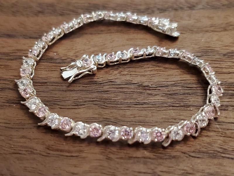Pink and White Sterling Silver Bracelet: Length: 7.5 Inches and 4.5mm wide Weight in Grams: 8.3 Hallmarks and Stamps: 925 Please note: All items are taken at stamped value and are not tested unless stated. As with many vintage items, pieces 