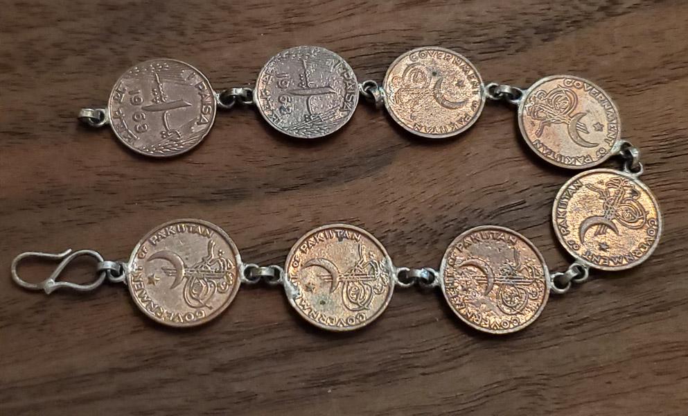 Pakistan 1961 and 1962 Paisa Coin Bracelet: Length: 7.5 inchesÃ‚ Weight in Grams: 12.87 Hallmarks and Stamps: N/A Clasp and links tested sterlingÃ‚ Please note: All items are taken at stamped value and are not tested unless stated. As wit