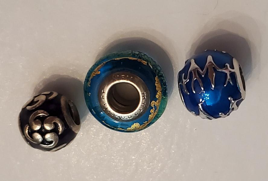 3 Sterling Silver Branded Slide Charms: Please see the pictures for full details as this is the exact item you will receive.Ã‚ Weight in Grams: 9.61Hallmarks and Stamps: 925,