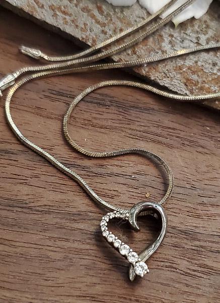 SAI Sterling Silver Journey Heart Necklace: Length: 18 Inches Weight in Grams: 4.93 Hallmarks and Stamps: 925, SAIÃ‚ Please note: All items are taken at stamped value and are not tested unless stated. As with many vintage items, pieces may h