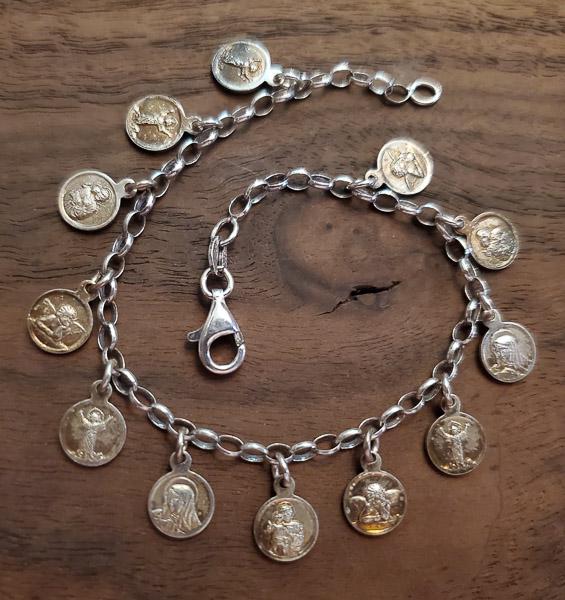 Cherub Sterling Silver Charm Bracelet: Length: 7.5 InchesÃ‚ Weight in Grams: 7.5 Hallmarks and Stamps: Italy, 925 Please note: All items are taken at stamped value and are not tested unless stated. As with many vintage items, pieces may