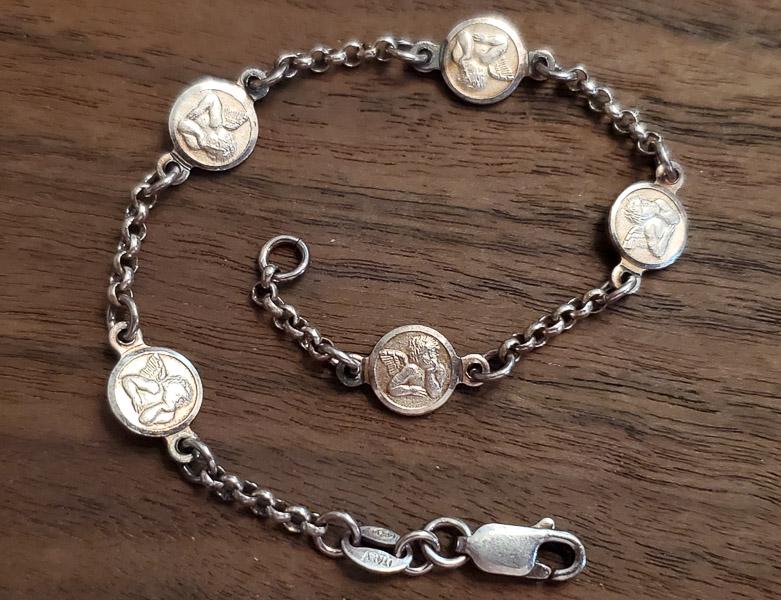 SA Sterling Silver Cherub Charm Bracelet: Length: 7.5 inches Weight in Grams:6.4 Hallmarks and Stamps: 925,SAÃ‚ Please note: All items are taken at stamped value and are not tested unless stated. As with many vintage items, pieces may have