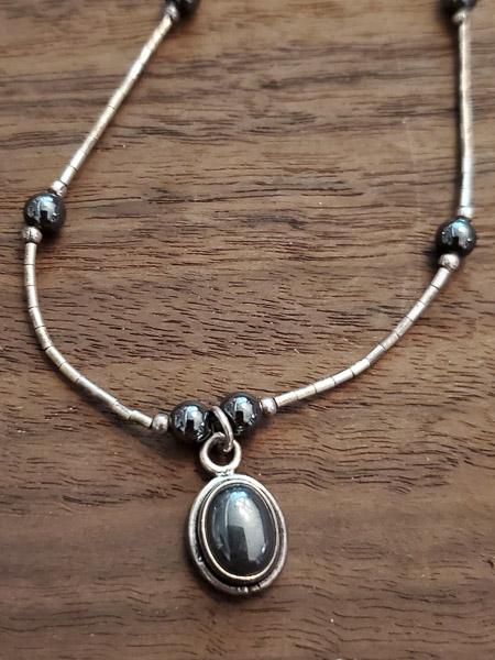 Liquid Sterling Silver Hematite Necklace: Length: 16 Inches Weight in Grams: 5.6 Hallmarks and Stamps: 925 Please note: All items are taken at stamped value and are not tested unless stated. As with many vintage items, pieces may have some si