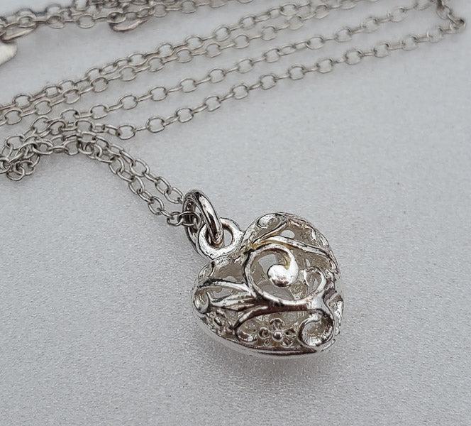 Heart Sterling Silver Necklace: Length: 16.75 inches Weighs 2 Grams Heart is 12mm by 10mm Hallmarks and Stamps:Ã‚ 925 Please note: All items are taken at stamped value and are not tested unless stated. As with many vintage items,