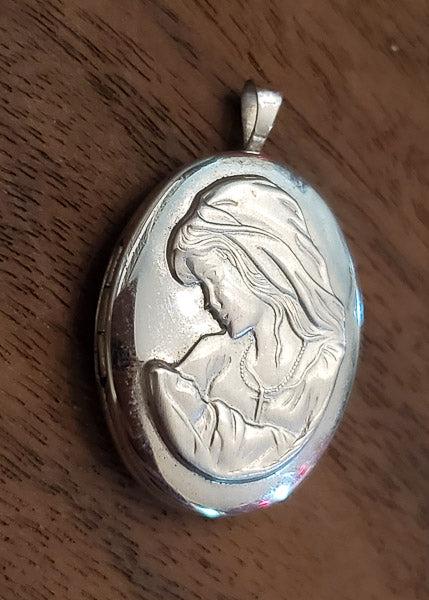 Mother and Child Sterling Cross Locket: Please see pics for details as this is the exact item you will receive.Ã‚ Measures: 31.5mm drop and 20mm wide Weight in Grams: 5 Hallmarks & Stamps Include:Ã‚ Ster., PP8 Please note: All ite