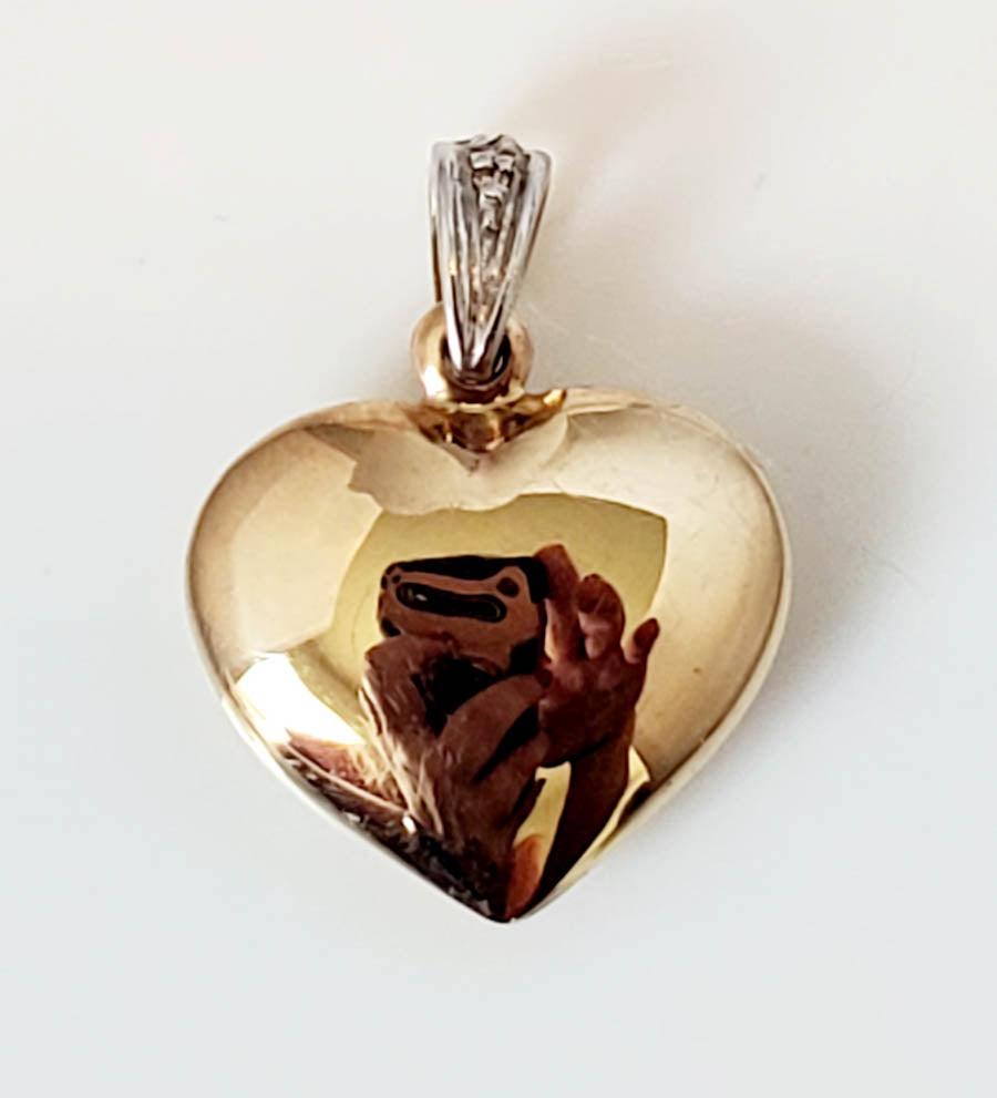 14k Gold Heart Pendant: Length: Has a 20mm drop and is 15mm wide Weight in Grams: .46 Hallmarks and Stamps: 585 Please note: All items are taken at stamped value and are not tested unless stated. As with many vintage items, 