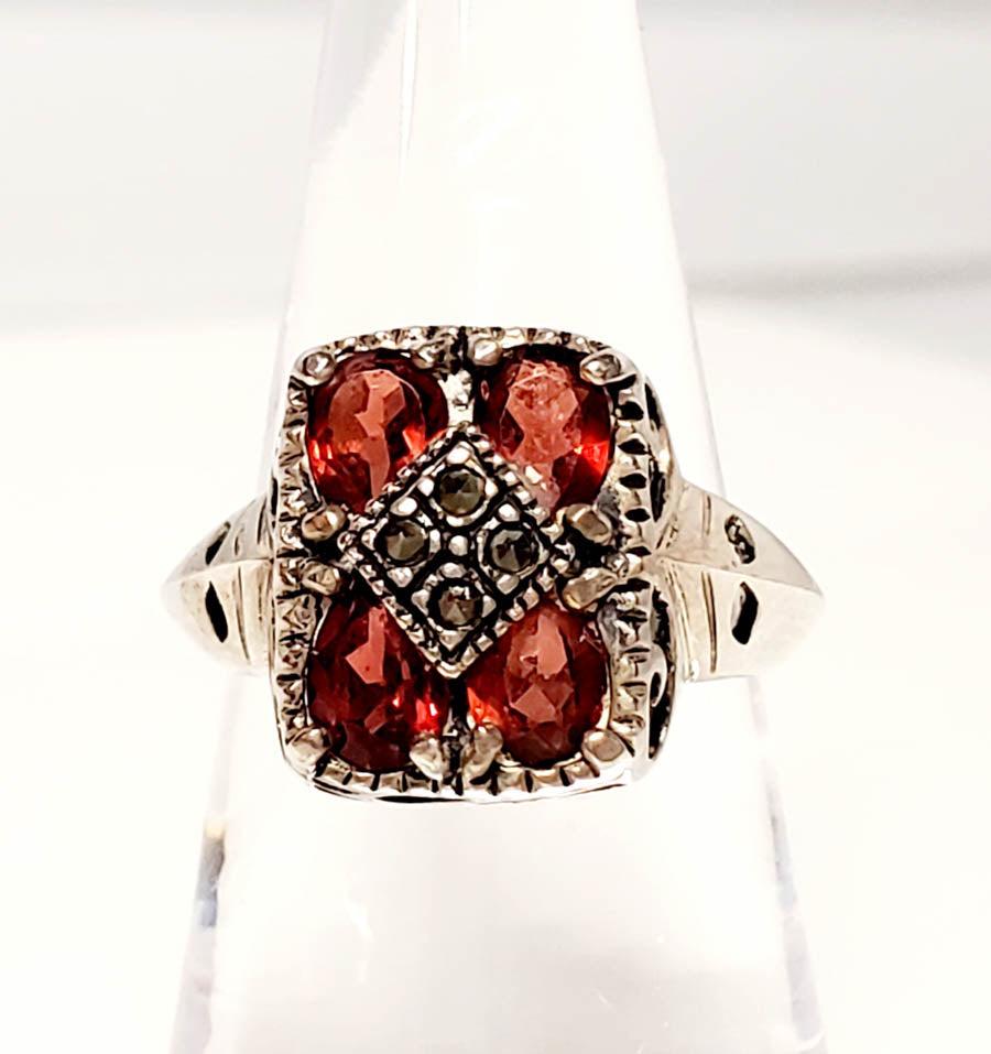 Vintage Sterling Silver Garnet Ring Size 6: Please see pics for details as this is the exact item you will receive.Ã‚ Size: 6 Item Details: 13.5mm Face Weight in Grams: 4.22 Hallmarks & Stamps Include: 925, JC Please note: All items are 