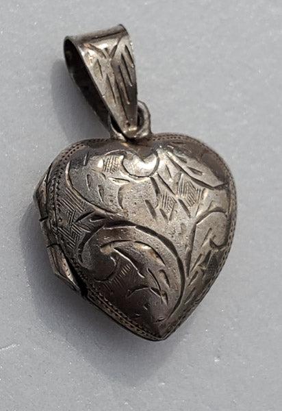 Sterling Silver Heart Locket Pendant: Please see the pictures for exact details as this is the item you will receive.Ã‚ Measurements: 23.5mm drop and 14.5mm wide Weight in Grams: 1.84 Hallmarks and Stamps: N/A Tested sterling Other:Ã�