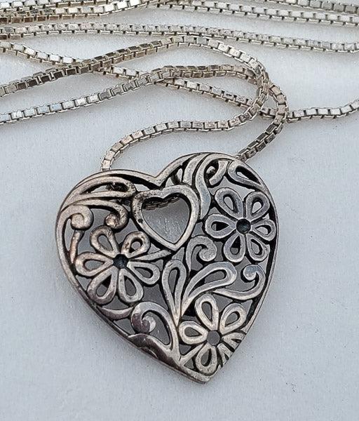Hearts and Flowers Sterling Silver Necklace: Length: 20 inches Pendant isÃ‚ 16.5mm by 16.5mm Width: N/A Hallmarks and Stamps: 925, TH Please note: All items are taken at stamped value and are not tested unless stated. As with many vintage ite