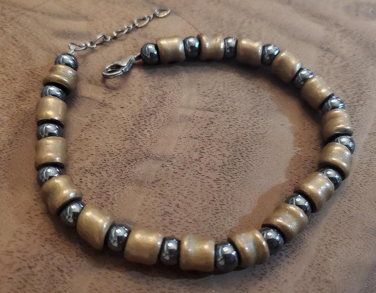 Hematite and Brass Bracelet: Please see pics for details as this is the exact item you will receive.Ã‚ Length: 8 to 9 inches Weight in Grams: 23.5 Hallmarks and Stamps: 925 on clasp Due to the limited amounts of cleaning and p