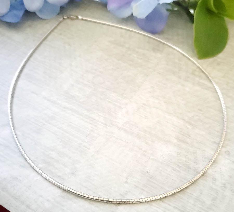 Sterling Silver Snake Cord Necklace: Sterling Silver Snake Cord Necklace Length: 16 Inches Width: 1.8 mm Shape/Style: Hard Snake Cord Other: Lobster Clasp Weight in Grams: 11.28 Hallmarks and Stamps: 925, Italy Ã‚ Please Note: All ite