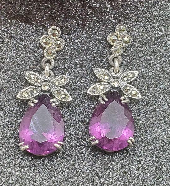 Purple Stone Sterling Silver Marcasite Earrings: Please see pics for details as this is the exact item you will receive.Ã‚ Item Details: These have a 31.5mm drop and are 12.5mm wide Weight in Grams: 5.9 Hallmarks & Stamps Include: 925 Due to 