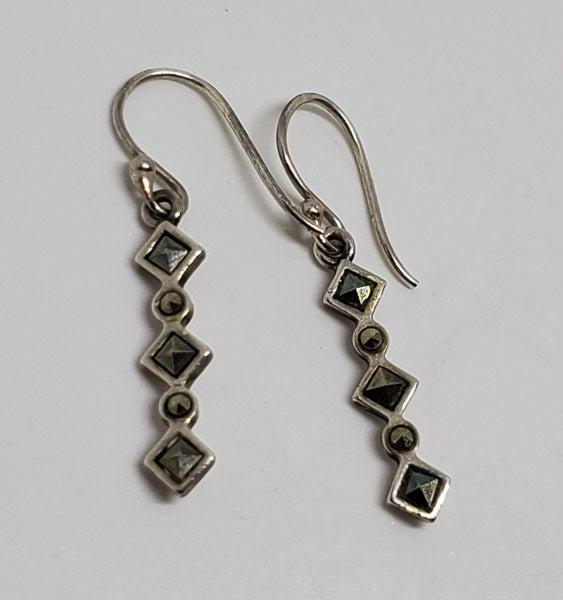 Dainty Marcasite Sterling Silver Earrings: Please see pics for details as this is the exact item you will receive.Ã‚ Item Details: They have a 31.5mm drop and are 4.3mm wide Weight in Grams: 1.58 Hallmarks & Stamps Include: 925 Due to t