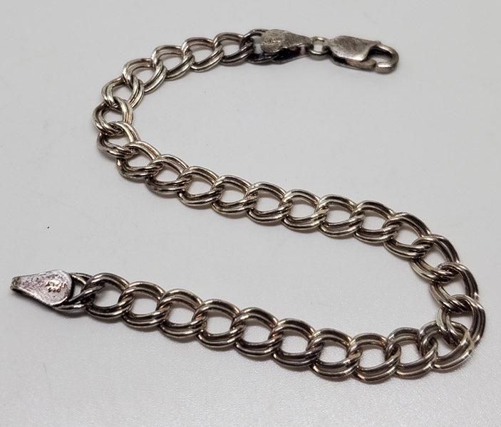 Sterling Silver Charm Bracelet: Please see pics for details as this is the exact item you will receive.Ã‚ Length: 7 inches Weight in Grams: 6.75 Hallmarks and Stamps: 925, Italy Due to the limited amounts of cleaning and polishin