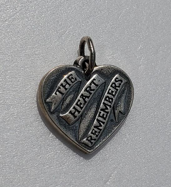JAMES AVERY The Heart Remembers Charm: Please see pictures for full details as this is the exact item you will receive. Measures: 16 by 16mm Weight in Grams: 3.33 Hallmarks and Stamps: 925, James Avery Symbol Please Note: All items are tak