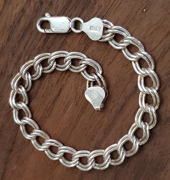 Classic Italy Sterling Silver Charm Bracelet: Please see the pictures for details as this is the exact item you will receiveÃ‚ Length: 6.75 InchesÃ‚ Width: at widest: 6.8 mm Weight in Grams: 10.07 Hallmarks and Stamps:Ã‚ 925, Italy, unkn