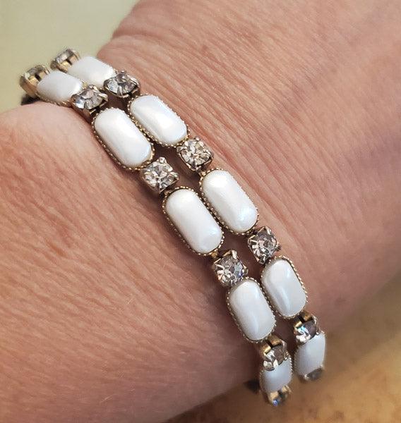 Vintage Rhinestone Swivel Bracelet: Please see pics for details as this is the exact item you will receive. The faux pearls swivel sideways due to the unique backing Length: 7 inches Width: Appx 12mm at widest Hallmarks and Stamps: N/A,